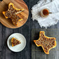 Texas-shaped turtle cheesecake covered with rich caramel and chopped Texas pecans