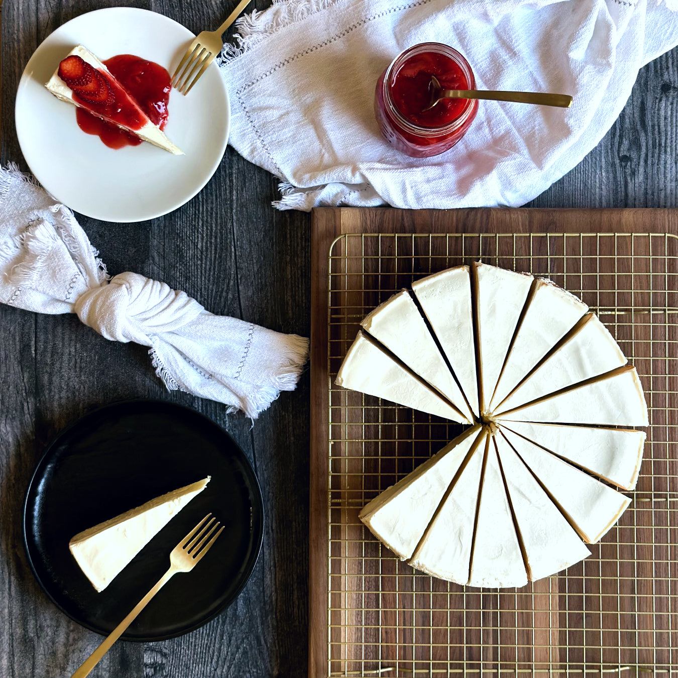 Perfectly sliced 10 inch handcrafted classic cheesecake, an individually plated slice of creamy cheesecake, and another plated slice of classic cheesecake elegantly topped with a vibrant red strawberry sauce. 