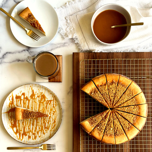 Golden 10 inch handcrafted salted caramel cheesecake, an individually plated slice of creamy salted caramel cheesecake, and a plated slice of salted caramel cheesecake with a drizzle of extra homemade salted caramel.